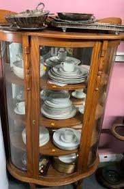 Oak Bow Front Curio Cabinet - Kaufman Realty & Auctions