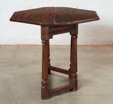 Lot - A Marshall Laird Jacobean style oak fold top credence ...