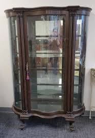 Sold at Auction: AMERICAN OAK CURVED GLASS CHINA CABINET, 1900