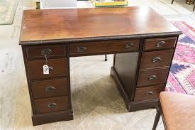 Lot - Semi antique mahogany desk with four drawers on each ...