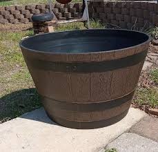 Southern Patio Large 22.24 in. Dia x 13 in. H 49 qt. Kentucky Walnut Medium Brown High-Density Resin Whiskey Barrel Outdoor Planter HDR