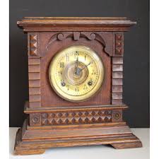An Antique Carved Oak Cased Mantle Clock Chiming on a Gong ...