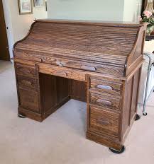 Lot 301: Oak Crest (Vernon, California) Roll Top, Finished Back Desk | EstateSales.org