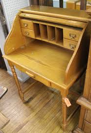 Sold at Auction: (2) Pieces laminate furniture: five-drawer Broyhill chest of drawers and a small size roll top desk; both with some light surface wear NO SHIPPING