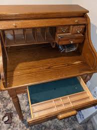 Wood Roll Top Desk w/ Carved legs by Powell | EstateSales.org