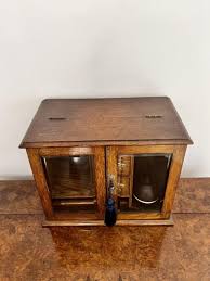 Fantastic quality antique Edwardian oak smokers cabinet at 1stDibs | edwardian smokers cabinet, antique pipe cabinet