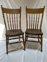 Sold at Auction: 2 Oak Pressed Back Plank Seat Chairs
