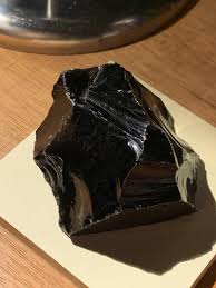 I was told this is obsidian, but I have a hunch that it is not. How do I know if it's fake or real? : r/whatsthisrock
