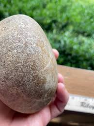 Found at the bottom of a lake in N. Maine. Weighs about 2 lbs, apparently stone. My son pulled this up from a pond in downeast maine. The longer end has a