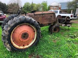 Oliver Row Crop 70 tractor, narrow front end,... | Reader ...
