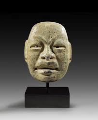 Sold at Auction: Olmek mask.