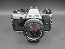 Olympus OM-10 35mm film camera. Zuiko Auto-S 50mm F/1.8 lens ...