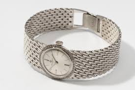 Lot - Baume et Mercier 14 Karat White Gold and Diamond Watch