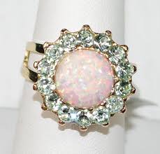 MARIANA RING ENCHANTED: cream simulated opal, green stones in 3/4" yel – European Accent