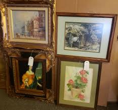 Lot - Four framed pieces: portrait of a lady, street scene ...