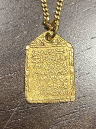 Seeking text and translation of this pendant : r/language