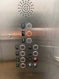 Elevators with floor buttons outside the elevator