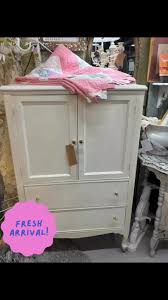 This sweet kitchen table and four chairs, two covered in a ...