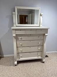 Dresser with mirror. Solid and in great functioning condition. Solids piece