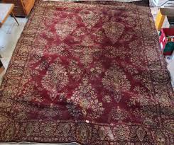 Lot - Machine woven Persian design room rug with rich deep ...