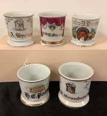 Lot - Lot of 5 Occupational Shaving Mugs, approx. 4” tall. Floral mug is chipped on base. One mug is marked T&V Austria, one is marked Pabst & Koehler, Columbus, Ohio.