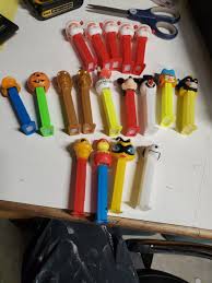 18 Pez Dispensers Santa, mickey, garfield, snoopy, marvel ...