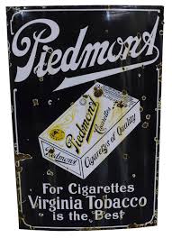 Lot - Vintage Piedmont (smokes) porcelain sign, cobalt blue background, white text and yellow accents, one sided sign, wear consistent with age including loss of porcelain, oxidation, etc.46 1/4" h. x 30"