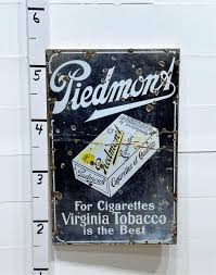 Sold at Auction: Piedmont Cigarettes Sign porcelain on wood frame / 46" x 30 1/8"