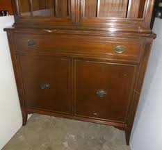 Antique Huntley China Cabinet, Beautiful Split Pediment With Finial Top, Missing Glass Panel in One Door, Minor Flaws But Very Good Condition Overall, 36"W x 17"D x 80"H, Matches Item #326 Auction |