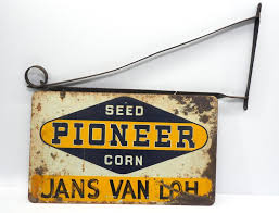 Sold at Auction: Pioneer Seed Corn sign with hanger