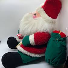 Plush toy of Santa holding candy cane in one hand and bag of toys over shoulder | eBay