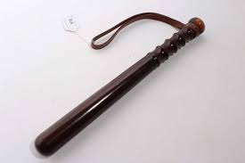 20th century turned wood police truncheon with ribbed grip and brown leather strap stamped Hiatt's. B.ham, named in ink W. H. La Touche, 38cm in length in United Kingdom