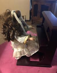 Vintage Doll on Piano