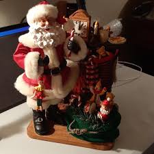 KIRKLAND SIGNATURE COLLECTION SANTA & TOY SACK AT FIREPLACE