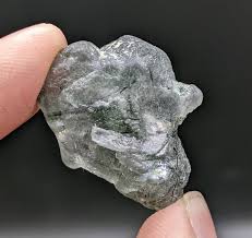 Light purple apatite single crystal with green basolite ...