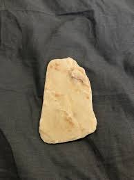 I've found many of these flat white rocks with vertical ...