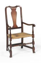 Sold at Auction: QUEEN ANNE ARMCHAIR In cherry. Yoke back with vasiform splat. Carved and molded scrolled arms. Block-turned legs end in Spanish fron...