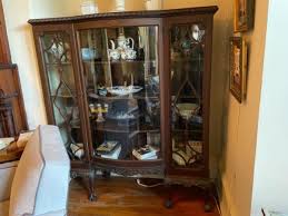 Antique Curio Cabinet With Curved Center Glass Door and Claw Feet - JB11253 | EstateSales.org