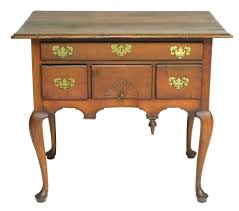 Lot - Queen Anne dressing table or lowboy, 18th C., American, Connecticut (Newtown-Woodbury) area, cherry, pine, poplar and chestnut, rectangular top, one long drawer over three small drawers, the center with carved