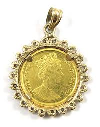 Lot - GOLD CAT COIN, DIAMOND AND YELLOW GOLD PENDANT,