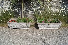 Sold at Auction: PAIR OF COMPOSITE STONE PLANTERS