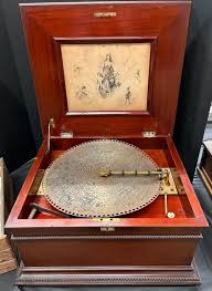 Sold at Auction: Regina Music Box and Discs