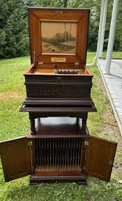 15 3/4” OLYMPIA CARVED OAK DISC MUSIC BOX WITH CABINET | eBay