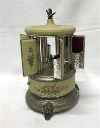 Sold at Auction: A Reuge Swiss Music Box & Carousel Cigarette Dispenser,