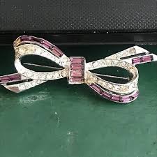 beautiful ora rhinestone bow brooch! purple baugettes!