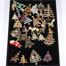 Sold at Auction: Vintage Christmas signed and unsigned crystal rhinestone costume jewelry group. 4"H x 2 1/8"W (largest brooch)