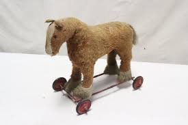 Sold at Auction: A vintage mohair horse on wheel