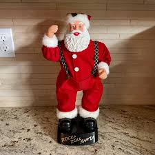 Rock and Roll Hip Swinging Santa. Sings Santa Clause is ...
