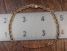 Lot - FOURTEEN KARAT YELLOW GOLD ID BRACELET