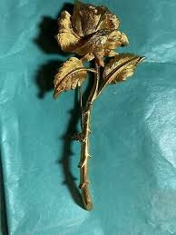 Golden long-stemmed rose brooch marked JW-B57 “All The Rage ...